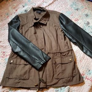 Cargo jacket with black  faux leather sleeves.